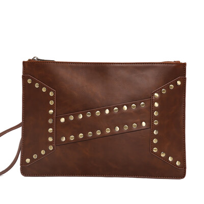 Retro fashion wrist bag tide cool rivet young men&women holding a bag Korean leather hand grab envelope bag
Retro fashion wrist bag tide cool rivet young men&women holding a bag Korean leather hand grab envelope bag