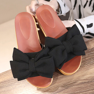 Slipper female summer wearing a beach bow a word tow woman high-heeled beach shoes anti-slip thick sole cool drag
Slipper female summer wearing a beach bow a word tow woman high-heeled beach shoes anti-slip thick sole cool drag