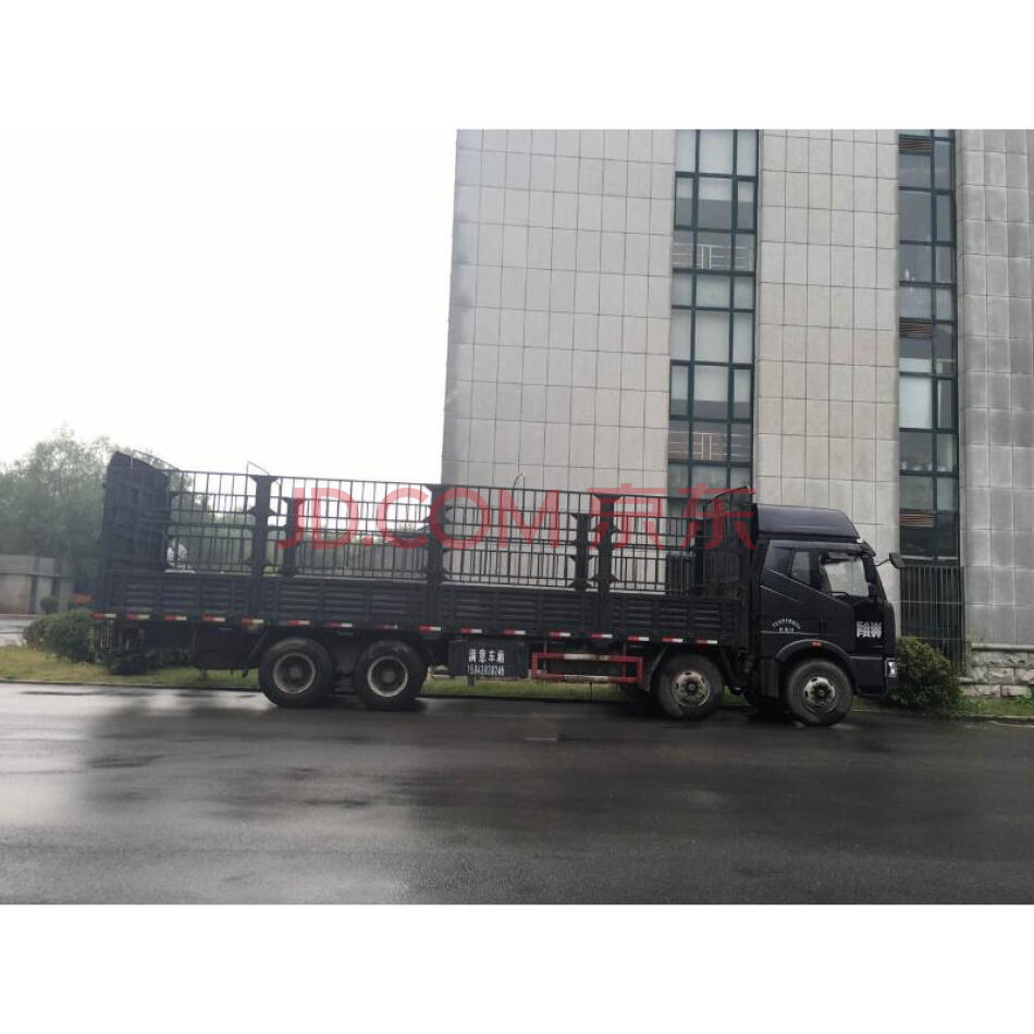 解放牌重型仓栅式货车车号为辽AF9979