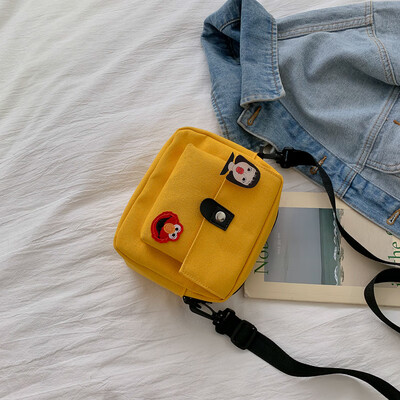 

Simple&versatile solid color temperament shoulder Messenger bag female 2019 new fashion cartoon cute canvas small square bag