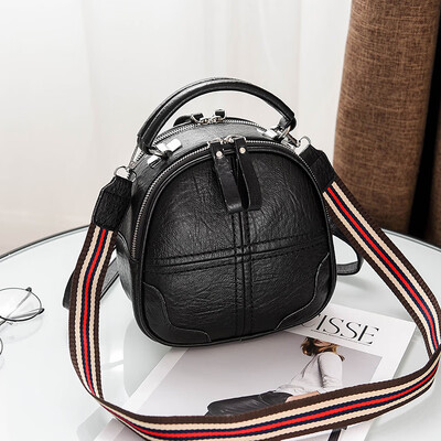 

A girl with a double shoulder bag a broadband shoulder bag a Korean version of a backpack a girl slanted a small round bag and