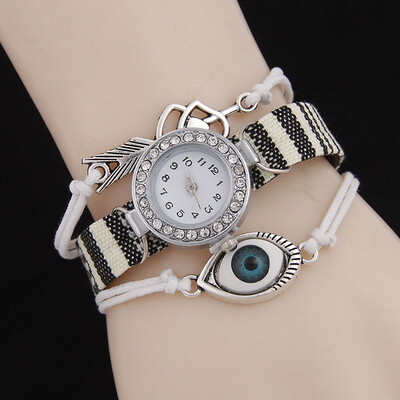 

Xianlejiao sloggi fashion ladies belt watch Three-ring winding ethnic wind-breaking rhinestone bracelet watch