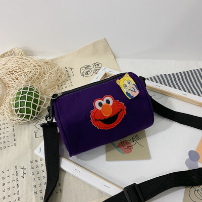 

Casual fashion ugly sesame street canvas cylinder bag female 2019 new cartoon simple versatile shoulder Messenger bag
