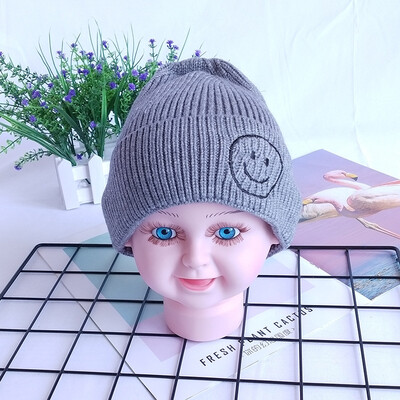 

Childrens wool hats Korea autumn&winter new warm smiling face knit cap head cap boys&girls baby hat candy