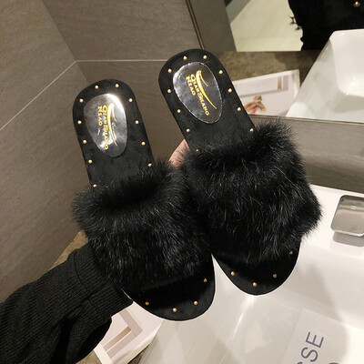 

Slippers woman Qiu Han version 100 hair slippers women wear flat-bottomed rabbit hair word drag