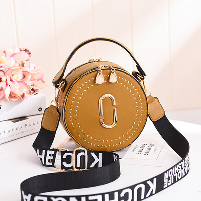 

Fashion rivet small round bag portable Korean version of the lady bag shoulder diagonal wide shoulder strap small bag
