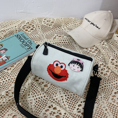 

2019 new cartoon simple versatile shoulder Messenger bag female casual fashion ugly sesame street canvas cylinder bag