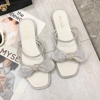 

Korean version of womens shoes in summer diamond bow flat-bottomed fairy wind fashion sandals worn by women