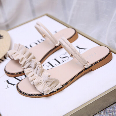 

Sandals female summer flat-bottomed Korean version 100 fairy sandals bow tie students wear two sandals on their toes