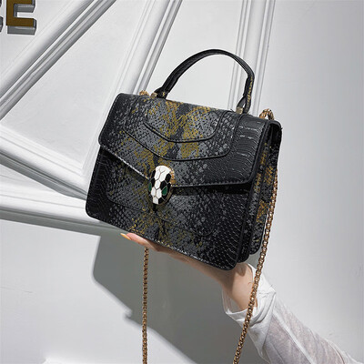 

Qiao Bani 2019 new European&American style fashion snake head BV snake pattern flip bag hand strap shoulder diagonal trend handbags