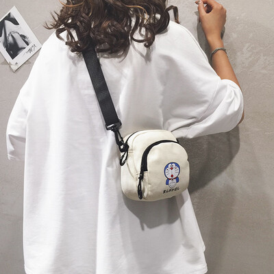 

Cartoon small bag female 2019 new wave Korean fashion wild print girl canvas student shoulder Messenger bag