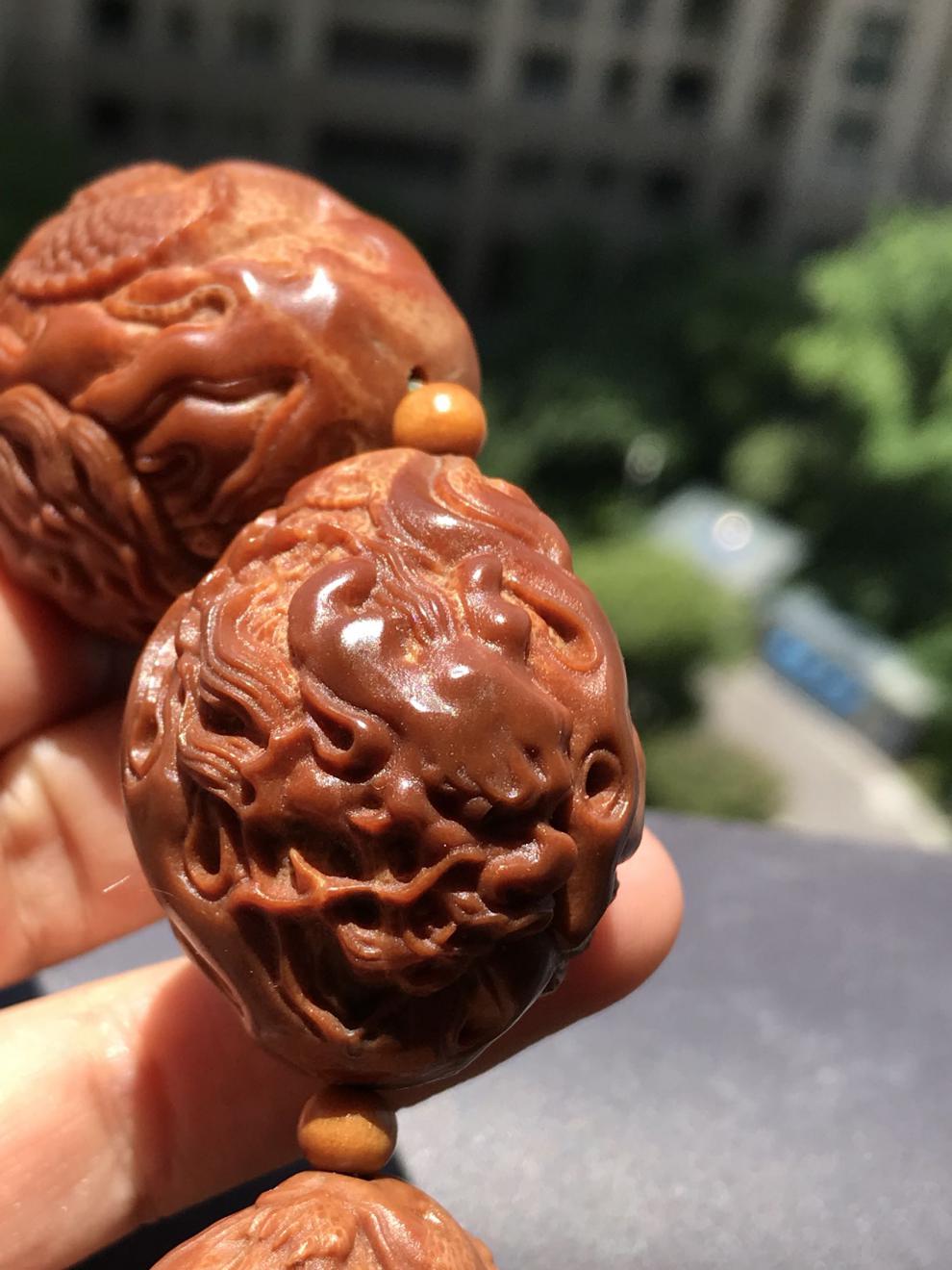 文玩手串男款橄榄核雕刻九龙献瑞手持印尼橄榄核手工雕刻九龙【图片