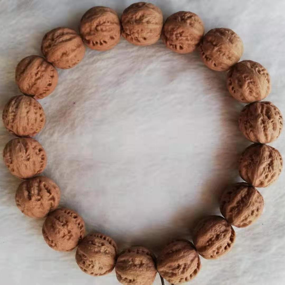 七夕文玩核桃野生山核桃秋子手持手串手把件脖挂磨盘白狮子官帽狮子头