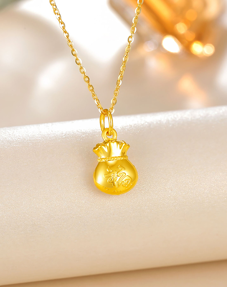9黄金吊坠平安纳福钱袋 约1.2-1.29g