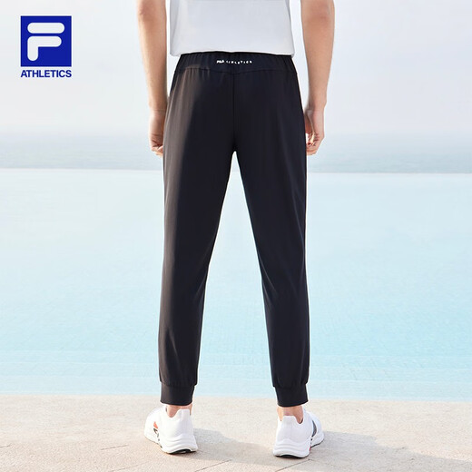 斐乐（FILA）官方男子针织高弹力凉感裤夏基础简约收口运动健身长裤 深黑-BK L