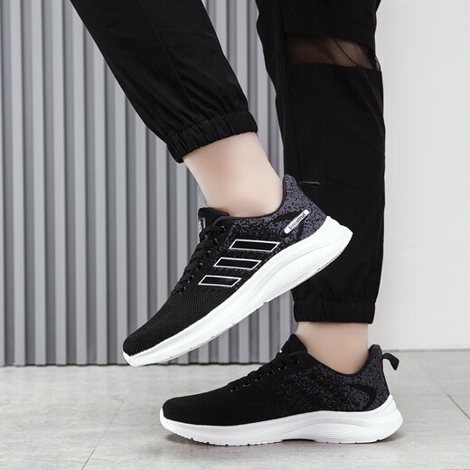 Zheduan Sports Schuhe Frühling und Sommer Neue Männerschuhe Herren lässige Laufschuhe Student Atmungsfreie Kleidung-resistente weiche Sohle-Stoßdämpfung fliegender Messer FH-Feda 9905 Schwarz-Weiß-Hintergrund 41