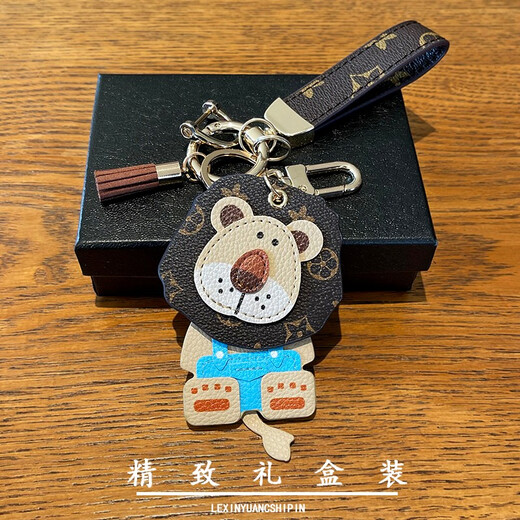 迪加伦 欧美潮流可爱创意小狮子汽车钥匙扣高档真皮钥匙扣男情侣款女士背包包挂饰挂链绳 咖色花纹+金扣