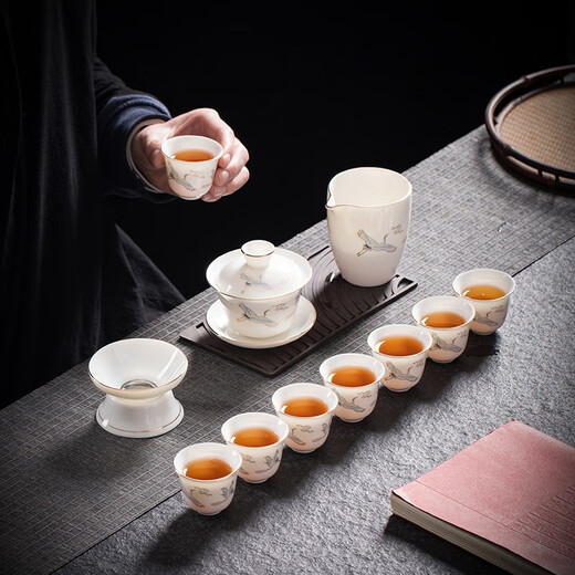 Yushige mutton-fat jade white porcelain Kung Fu tea set high-end simple home office reception ceramic bowl set of 8 cups with golden auspicious crane and auspicious orchid fragrance eight cups safety package 12 pieces (safety packaging) free tea towel