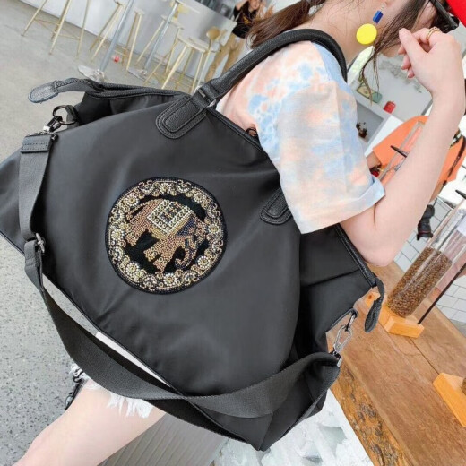 HANKESDUN travel bag, waterproof canvas boarding bag, fashionable hand luggage bag, short-distance cross-body backpack, large-capacity fitness bag