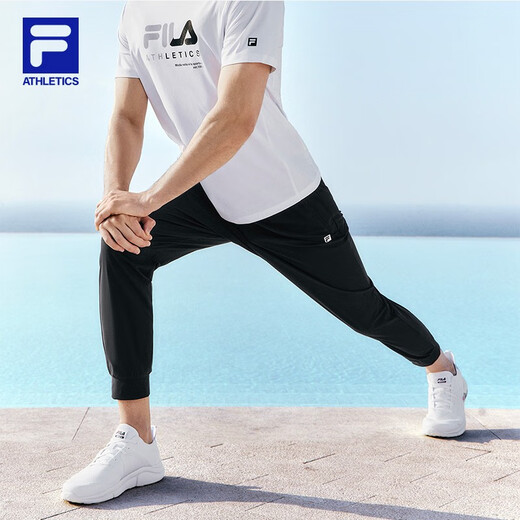 斐乐（FILA）官方男子针织高弹力凉感裤夏基础简约收口运动健身长裤 深黑-BK L