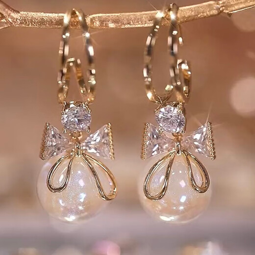 Xiaose 2025 new style bow imitation pearl earrings, high-end temperament earrings, personalized light luxury French earrings, bow earrings E2448