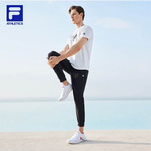 斐乐（FILA）官方男子针织高弹力凉感裤夏基础简约收口运动健身长裤 深黑-BK L