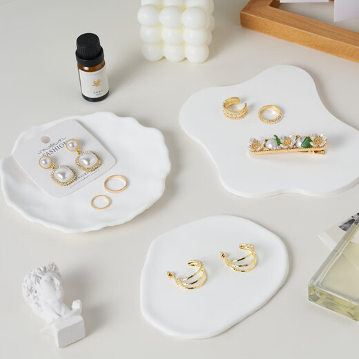 Light and shadow stars white gypsum ornaments ins style decoration scene construction and layout small objects photography props jewelry necklace ring earrings still life product photography creativity big cube aromatherapy candle