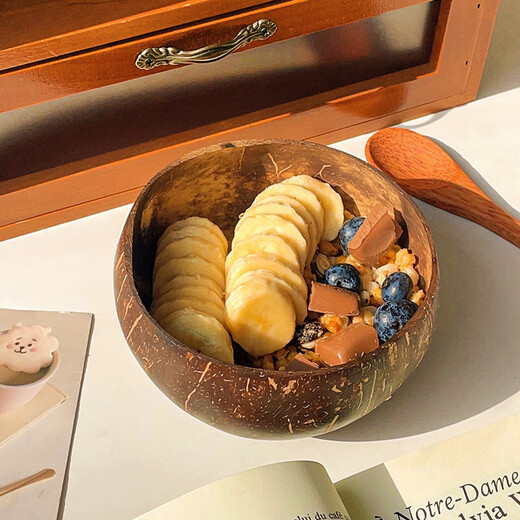 Badger yogurt bowl with spoon wooden dessert fruit salad home breakfast oatmeal natural coconut shell bowl