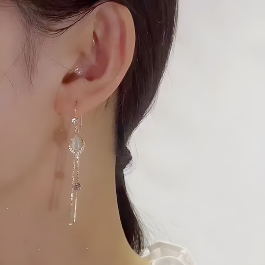 UOSU earrings for women, light luxury and high-end, cat's eye long earrings, versatile ins niche design ear wire, super fairy fashion jewelry, cat's eye tassel ear wire