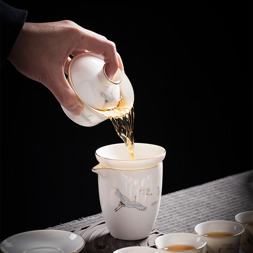 Yushige mutton-fat jade white porcelain Kung Fu tea set high-end simple home office reception ceramic bowl set of 8 cups with golden auspicious crane and auspicious orchid fragrance eight cups safety package 12 pieces (safety packaging) free tea towel