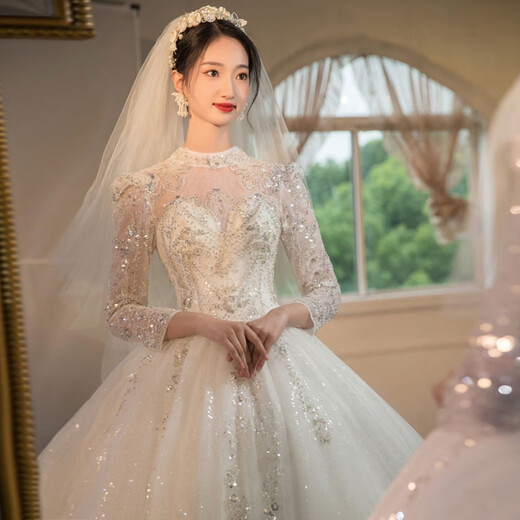 Red makeup best winter wedding dress 2025 new bridal main yarn high-end heavy industry trailing French long-sleeved wedding dress light champagne floor-length L