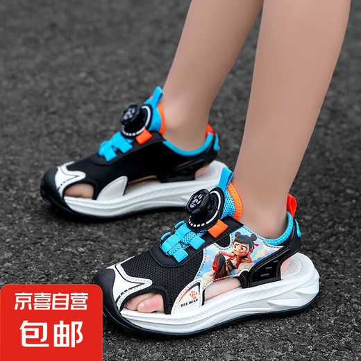 2025 Sommer Neue Jungen Sandalen Kinder rotierende Schnalle Mode atmungsable, weiche Sohle nicht rutschende Baotou Beach Sandalen Trendy 983-Black Orange 34