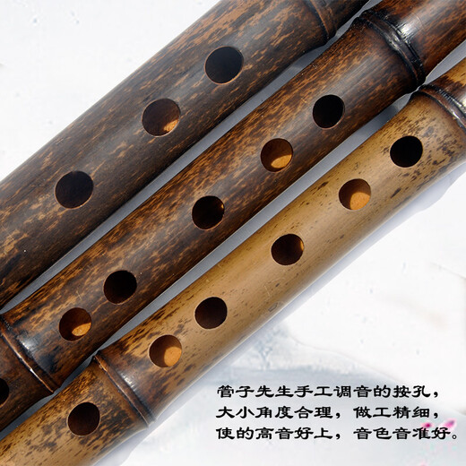 La flûte en bambou violet à la main de M. Guan Zi a joué professionnellement la flûte horizontale sélectionnée MATÉRIAUX SÉLECTIONNEL