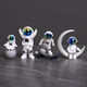 Mengyigang kreative Astronaut-Ornamente Desktop kleine Astronaut Schreibtisch TV-Schrankzimmer Dekoration Autokonsole-Ornamente Sternenhimmel Vierteilige Set (insgesamt 8 Stücke)
