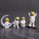 Mengyigang kreative Astronaut-Ornamente Desktop kleine Astronaut Schreibtisch TV-Schrankzimmer Dekoration Autokonsole-Ornamente Sternenhimmel Vierteilige Set (insgesamt 8 Stücke)