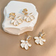 Bai Qixin flower pearl earrings, women's high-end pierced earrings, unique temperament earrings, forest style earrings, a pair of petal pearl earrings