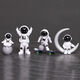 Mengyigang kreative Astronaut-Ornamente Desktop kleine Astronaut Schreibtisch TV-Schrankzimmer Dekoration Autokonsole-Ornamente Sternenhimmel Vierteilige Set (insgesamt 8 Stücke)