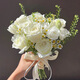 Wedding flowers holding flowers in hand, bride holding wedding pictures with tulips and gets a marriage certificate and simulated flowers taking photos of Chinese Valentine's Day. Pink and white flowers holding flowers
