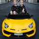 Join hands with an extra-large two-seater Lamborghini children's electric car toy that can sit on a baby's remote-controlled child stroller. Upgraded green full-featured + MP4 + 12A ultra-powerful battery, tug + portable charging + hydraulic butterfly wing door