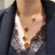 Fat Donglai same style 18K gold four-leaf clover necklace for women 18K rose gold pendant six-flower long sweater red tiger eye stone six-flower rose gold