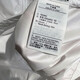 耐克（NIKE）官方女装2025秋季新款运动休闲风衣防风连帽潮流上衣梭织外套 DM6180-100/白色 M