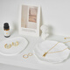 Light and shadow stars white gypsum ornaments ins style decoration scene construction and layout small objects photography props jewelry necklace ring earrings still life product photography creativity big cube aromatherapy candle
