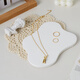 Light and shadow stars white gypsum ornaments ins style decoration scene construction and layout small objects photography props jewelry necklace ring earrings still life product photography creativity big cube aromatherapy candle