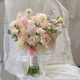 Wedding flowers holding flowers in hand, bride holding wedding pictures with tulips and gets a marriage certificate and simulated flowers taking photos of Chinese Valentine's Day. Pink and white flowers holding flowers