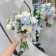 Wedding flowers holding flowers in hand, bride holding wedding pictures with tulips and gets a marriage certificate and simulated flowers taking photos of Chinese Valentine's Day. Pink and white flowers holding flowers
