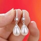 Wanmu 2025 sterling silver 9999 silver earrings women's temperament pearl ear hooks anti-allergic white silver ear hook pearls