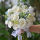 Wedding flowers holding flowers in hand, bride holding wedding pictures with tulips and gets a marriage certificate and simulated flowers taking photos of Chinese Valentine's Day. Pink and white flowers holding flowers