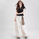 Nome Summer Schulter T-Shirt Top Faden Polo Shirt Frauenseite plissierte schlanke kurzärmelige T-Shirt schwarz Stickstil M.