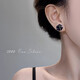 Ruihongxiang 999 sterling silver earrings black camellia earrings for women light luxury niche design temperament earrings 2025 new earrings 999 sterling silver earrings black camellia earrings pair