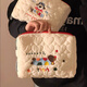 Bolsa de maquillaje de alto valor muxingyu, bolsa de almacenamiento de viaje portátil de gran capacidad, productos para el cuidado de la piel, artículos de tocador, cachorro de coloridos bordados